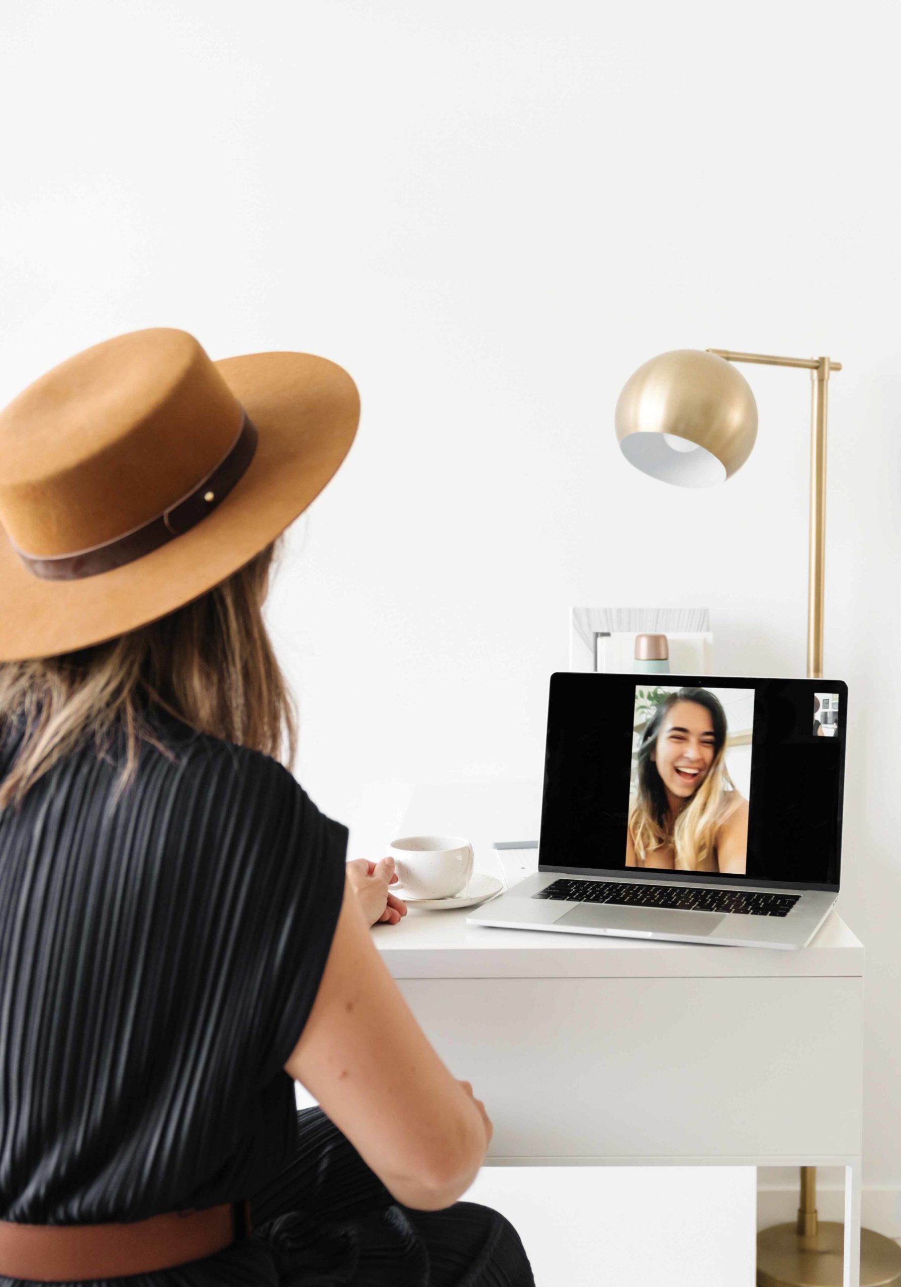 Two Woman Speaking to each other on a zoom call, woman is thinking about improving her client experience